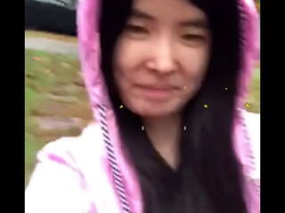 Asian teen publicly reveals herself in the rain!